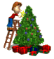 Image of christmas_boy_decorating_tree_sm_wht_30413.gif